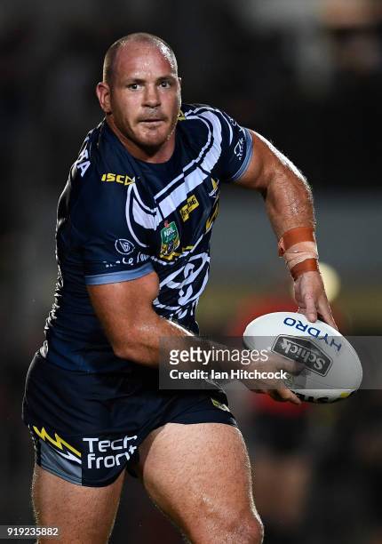 Matt Scott of the Cowboys runs the ball during the NRL trial match between the North Queensland Cowboys and the Wests Tigers at Barlow Park on...