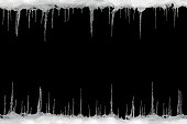 Icicles on a black background, space for text, template for design