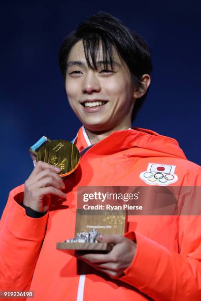 Gold medalist Yuzuru Hanyu of Japan celebrates during the medal ceremony for the Men's Figure Skating - Single Free Skating on day eight of the...