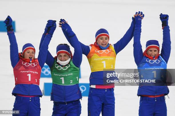 Norway's Ingvild Flugstad Oestberg, Norway's Astrid Uhrenholdt Jacobsen, Norway's Ragnhild Haga and Norway's Marit Bjorgen celebrate on the podium...