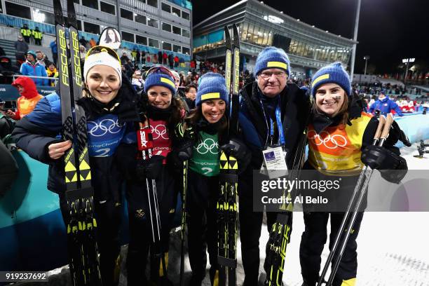 Silver medalists Stina Nilsson, Ebba Andersson, Charlotte Kalla and Anna Haag of Sweden celebrate with King Carl Gustaf of Sweden after the Ladies'...