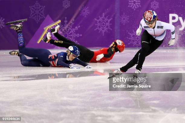 Jinyu Li of China and Elise Christie of Great Britain fall as Minjeong Choi of Korea skates past during the Short Track Speed Skating Ladies' 1500m...