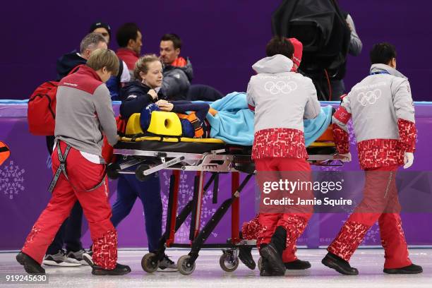 Elise Christie of Great Britain is taken off the ice on a stretcher after a collision during the Short Track Speed Skating Ladies' 1500m Semifinals...