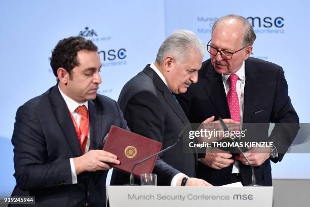 Turkish Prime Minister Binali Yildirim talks with the chairman of the Munich Security Conference Wolfgang Ischinger during the Munich Security...