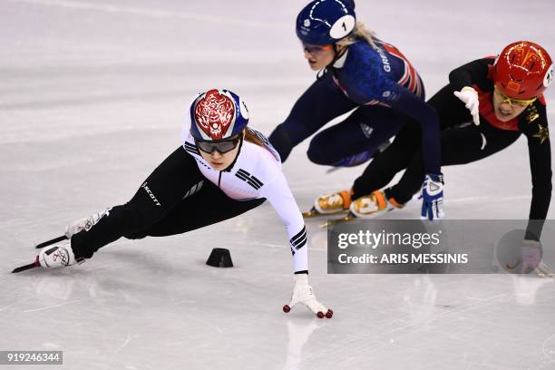 South Korea's Choi Minjeong, Britain's Elise Christie and China's Li Jinyu compete in the women's 1,500m short track speed skating semi-final event...