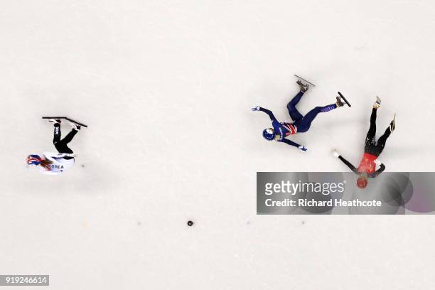 Jinyu Li of China and Elise Christie of Great Britain fall after contact as Minjeong Choi of Korea skates past during the Short Track Speed Skating...