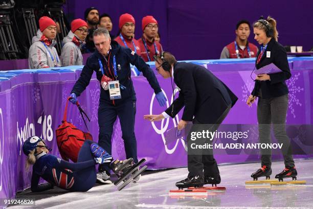 Britain's Elise Christie receives attention after a crash in the women's 1,500m short track speed skating semi-final event during the Pyeongchang...