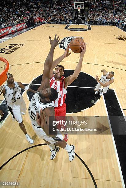 Ioannis Bourousis of the Greece Olympiacos puts up a shot against DeJuan Blair of the San Antonio Spurs during the exhibition game on October 9, 2009...