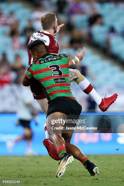 Sam Tomkins of Wigan is tackled by Hymel Hunt of the Rabbitohs during the NRL trial match between the South Sydney Rabbitohs and Wigan at ANZ Stadium...