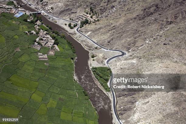 An aerial view from a US Army helicopter shows farm fields of wheat and corn along the Pech River valley September 4, 2009 between Asadabad, the...