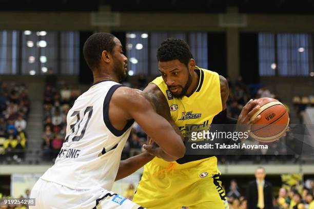 Branden Dawson of the Sunrockers Shibuya handles the ball under pressure from Hilton Armstrong of the Ryukyu Golden Kings during the B.League match...