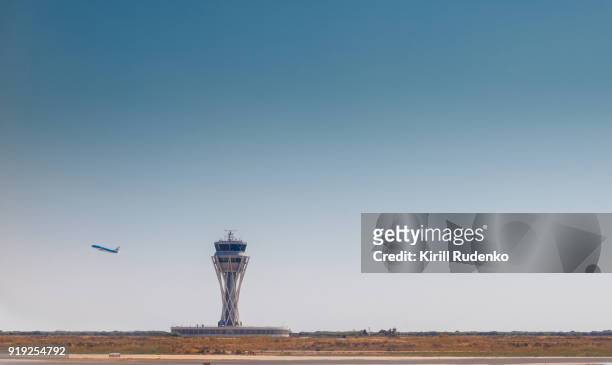 a plane taking off at el prat airport, barcelona spain - control tower stock pictures, royalty-free photos & images