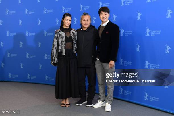 Mina Fujii, Kim Ki-duk and Lee Sung-jae pose at the 'Human, Space, Time and Human' photo call during the 68th Berlinale International Film Festival...
