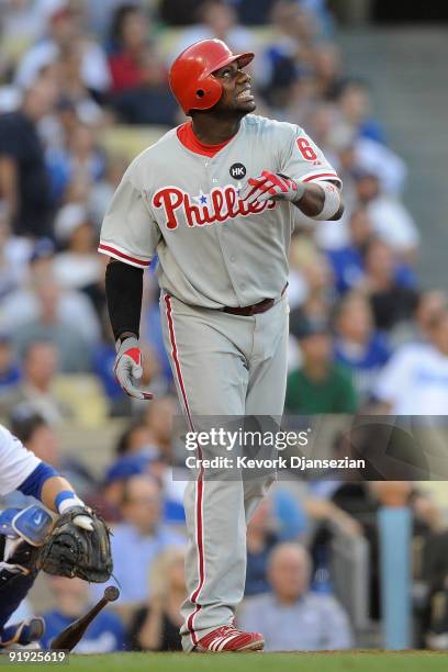 Ryan Howard of the Philadelphia Phillies eyes the flight of the ball as he flies out to left field in the second inning of Game One of the NLCS...