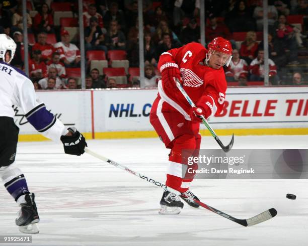 Nicklas Lidstrom of the Detroit Red Wings takes a shot during a NHL game against the Los Angeles Kings at Joe Louis Arena on October 15, 2009 in...