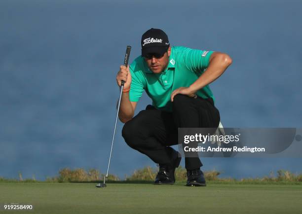 Matthew Southgate of England lines up a putt on the 18th hole during the third round of the NBO Oman Open at Al Mouj Golf on February 17, 2018 in...