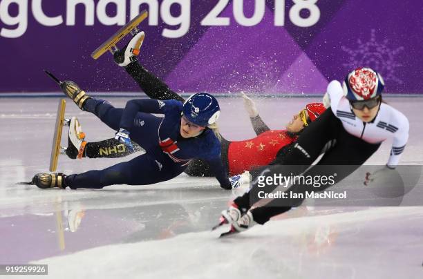 Elise Christie of Great Britain collides with Yang Zhou of China in the semi final of the Women's1500m during the Short Track Speed Skating on day...