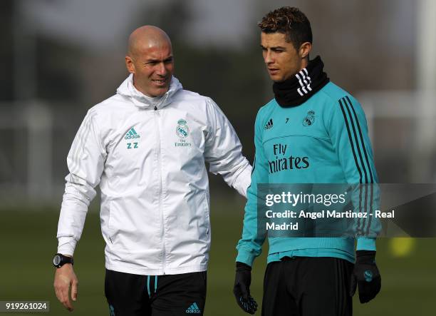 Head coach Zinedine Zidane and Cristiano Ronaldo of Real Madrid during a training session at Valdebebas training ground on February 17, 2018 in...