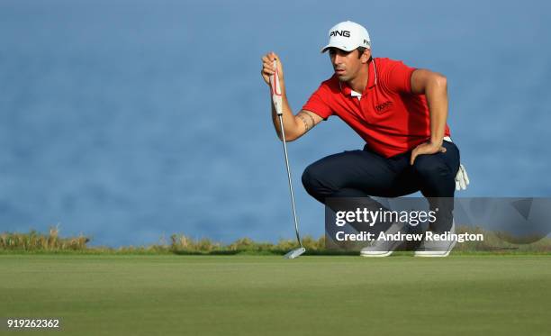 Matthieu Pavon of France lines up a putt on the 18th hole during the third round of the NBO Oman Open at Al Mouj Golf on February 17, 2018 in Muscat,...