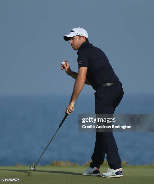 Julien Guerrier of France waves to the crowd on the 18th hlole during the third round of the NBO Oman Open at Al Mouj Golf on February 17, 2018 in...