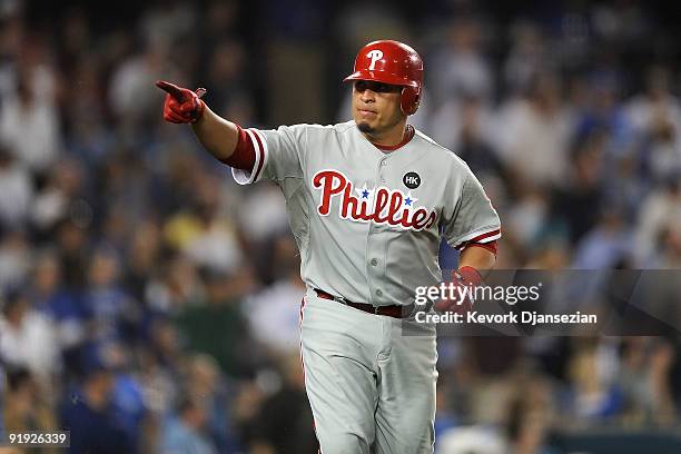 Carlos Ruiz of the Philadelphia Phillies celebrates as he runs the bases afer hitting a three run home run in the fifth inning in Game One of the...