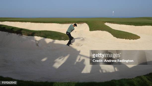 Chris Wood of England plays his third shot on the 18th hole during the third round of the NBO Oman Open at Al Mouj Golf on February 17, 2018 in...