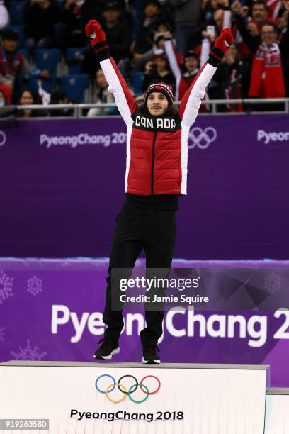 Gold medalist Samuel Girard of Canada celebrates during the victory ceremony after the Short Track Speed Skating Men's 1000m Final A on day eight of...