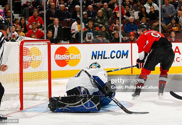 Milan Michalek of the Ottawa Senators scores on a backhand shot against Mike Smith of the Tampa Bay Lightning during a game at Scotiabank Place on...