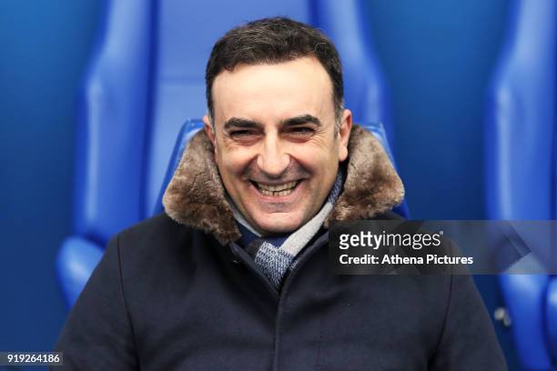 Swansea manager Carlos Carvalhal sits on the bench during The Emirates FA Cup Fifth Round match between Sheffield Wednesday and Swansea City at...