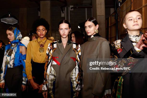 Models backstage ahead of the Toga show during London Fashion Week February 2018 on February 17, 2018 in London, England.