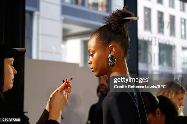Model backstage ahead of the Toga show during London Fashion Week February 2018 on February 17, 2018 in London, England.