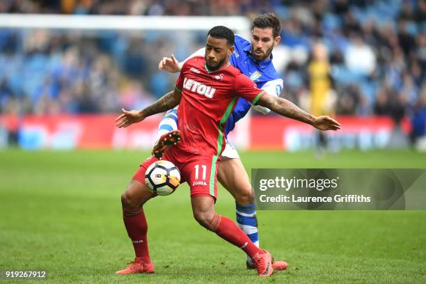 Luciano Narsingh of Swansea City is challenged by Frederico Venâncio of Sheffield Wednesday during the The Emirates FA Cup Fifth Round between...