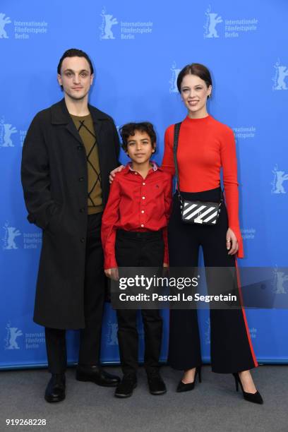 Franz Rogowski, Lilien Batman and Paula Beer pose at the 'Transit' photo call during the 68th Berlinale International Film Festival Berlin at Grand...