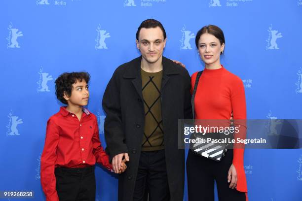 Franz Rogowski, Lilien Batman and Paula Beer pose at the 'Transit' photo call during the 68th Berlinale International Film Festival Berlin at Grand...