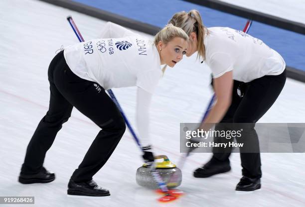 Anna Sloan and Vicki Adams of Great Britain sweep in a match against South Korea during the Women's Curling Round Robin on day eight of the...