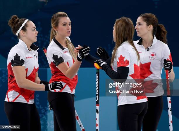 Joanne Courtney, Emma Miskew Rachel Homan and Lisa Weagle of Canada celebrate a score against the United States during the Women's Curling Round...