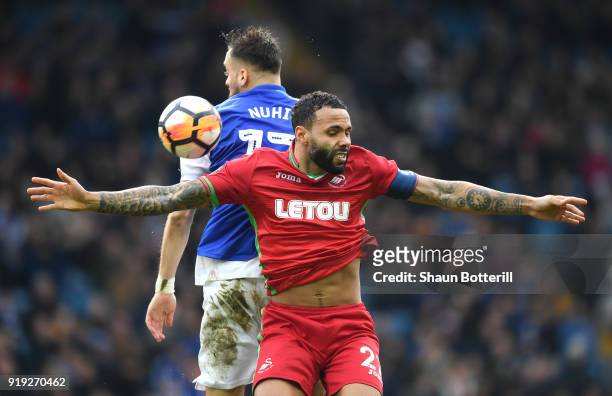 Kyle Bartley of Swansea City competes for the ball with Atdhe Nuhiu of Sheffield Wednesday during the The Emirates FA Cup Fifth Round between...
