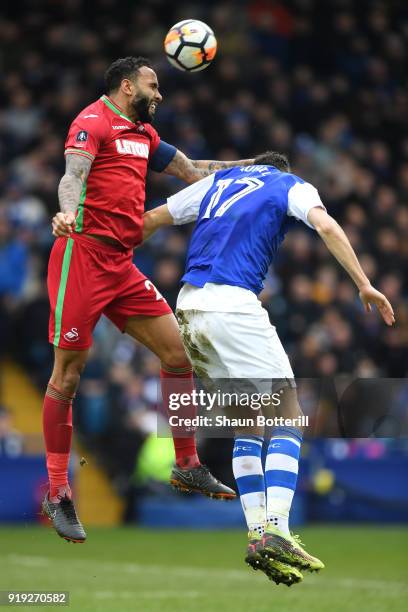 Kyle Bartley of Swansea City competes for the ball with Atdhe Nuhiu of Sheffield Wednesday during the The Emirates FA Cup Fifth Round between...