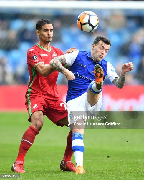 Kyle Naughton of Swansea City and Ross Wallace of Sheffield Wednesday battle for the ball during the The Emirates FA Cup Fifth Round between...