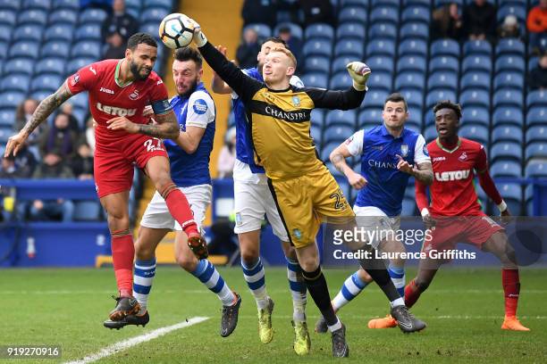 Cameron Dawson of Sheffield Wednesday clears the ball from a header by Kyle Bartley of Swansea City during the The Emirates FA Cup Fifth Round...