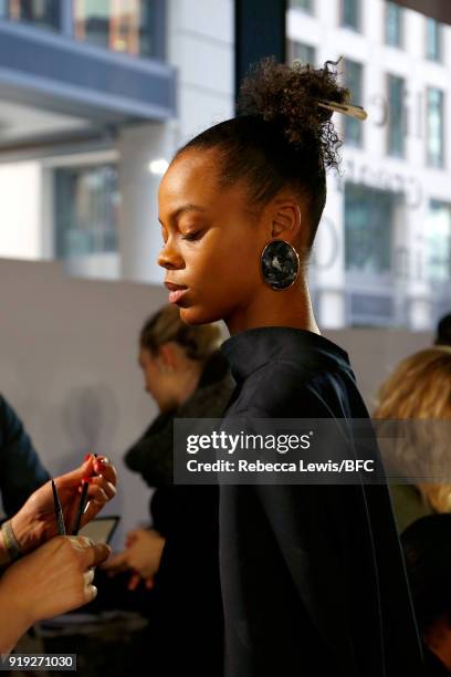 Model backstage ahead of the Toga show during London Fashion Week February 2018 on February 17, 2018 in London, England.