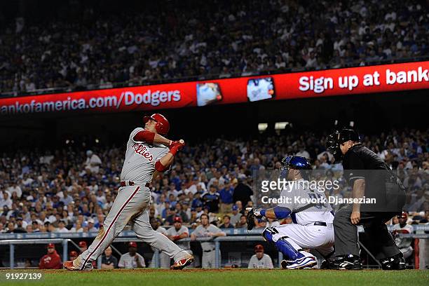 Carlos Ruiz of the Philadelphia Phillies hits a three run home run in the fifth inning in Game One of the NLCS off of pitcher Clayton Kershaw of the...