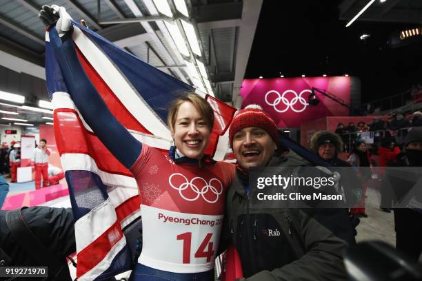 Lizzy Yarnold of Great Britain celebrates as she wins gold with husband James Roche during the Women's Skeleton on day eight of the PyeongChang 2018...