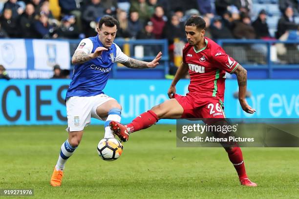 Ross Wallace of Sheffield Wednesday and Kyle Naughton of Swansea City in action during The Emirates FA Cup Fifth Round match between Sheffield...