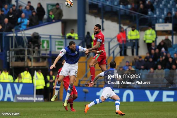 Kyle Bartley of Swansea City heads the ball away from Atdhe Nuhiu of Sheffield Wednesday during The Emirates FA Cup Fifth Round match between...