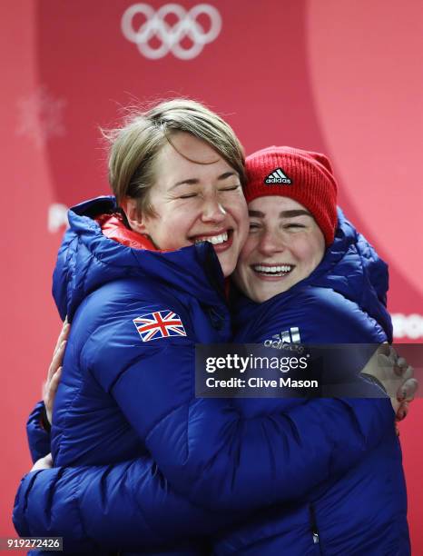 Gold medal winner Lizzy Yarnold of Great Britain and bronze medalist Laura Deas of Great Britain celebrate following the Women's Skeleton on day...