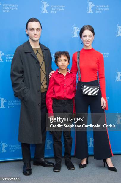 Franz Rogowski, Lilien Batman and Paula Beer pose at the 'Transit' photo call during the 68th Berlinale International Film Festival Berlin at Grand...