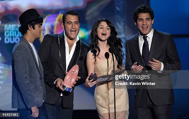 Actress Selena Gomez and musical group "Reik" present the Mejor Grupo O Duo award onstage at the "Los Premios MTV 2009" Latin America Awards held at...