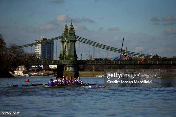 The crews pass under Hammersmith Bridge during the Boat Race Trial race between Cambridge University Women's Boat Club and University of London on...