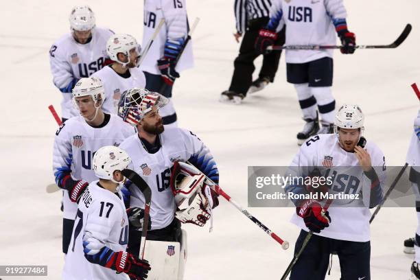 Ryan Zapolski and Bobby Sanguinetti of the United States react after being defeated 4-0 by Olympic Athlete from Russia during the Men's Ice Hockey...